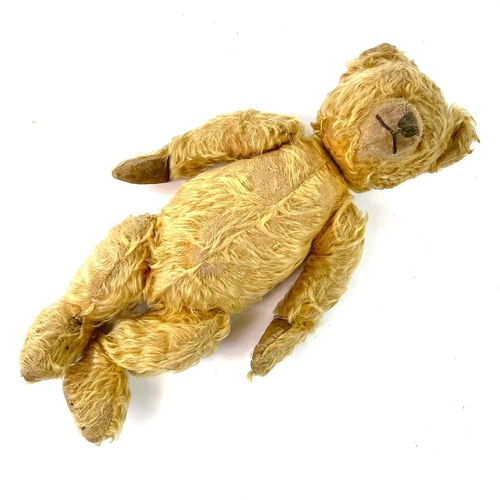 736 - Early to Mid 20th Century Teddy Bear Comprising an articulated plush golden coloured bear (length 42... 