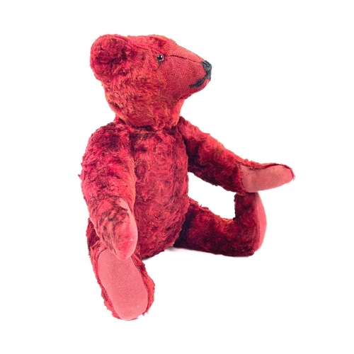 737 - Mid 20th Century Red Plush Teddy Bear. Comprising an articulated plush red bear (length 35cm), possi... 