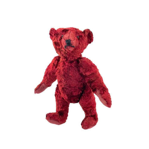 737 - Mid 20th Century Red Plush Teddy Bear. Comprising an articulated plush red bear (length 35cm), possi... 