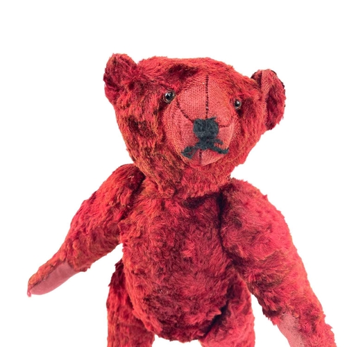 737 - Mid 20th Century Red Plush Teddy Bear. Comprising an articulated plush red bear (length 35cm), possi... 