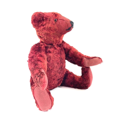 737 - Mid 20th Century Red Plush Teddy Bear. Comprising an articulated plush red bear (length 35cm), possi... 