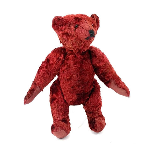 737 - Mid 20th Century Red Plush Teddy Bear. Comprising an articulated plush red bear (length 35cm), possi... 