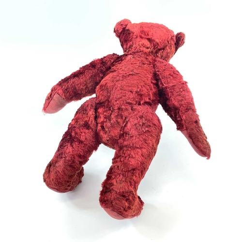 737 - Mid 20th Century Red Plush Teddy Bear. Comprising an articulated plush red bear (length 35cm), possi... 