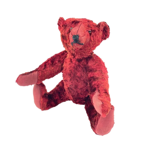 737 - Mid 20th Century Red Plush Teddy Bear. Comprising an articulated plush red bear (length 35cm), possi... 