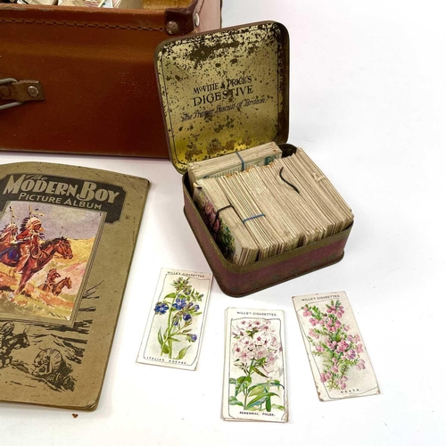 930 - Cigarette Cards An attache case holding a large quantity of cigarette cards contained in tins, a box... 