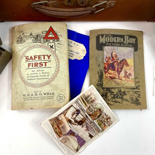 930 - Cigarette Cards An attache case holding a large quantity of cigarette cards contained in tins, a box... 