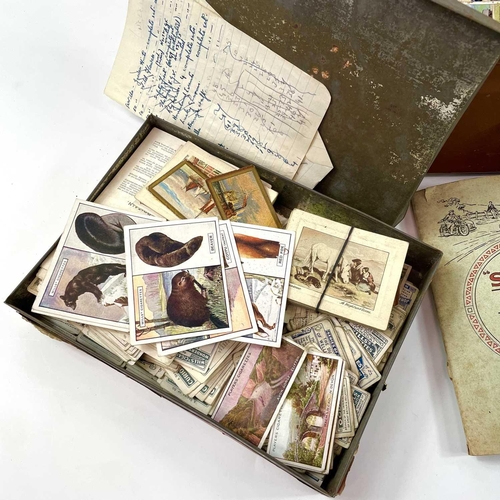 930 - Cigarette Cards An attache case holding a large quantity of cigarette cards contained in tins, a box... 