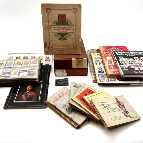 977 - Cigarette & Trade Cards. Large accumulation in a plastic tub which includes 3 albums containing sets... 