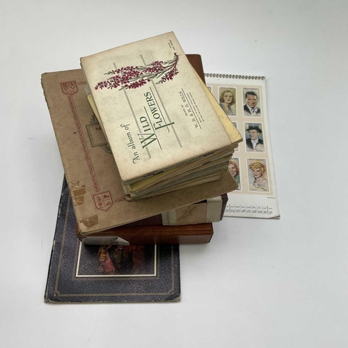 977 - Cigarette & Trade Cards. Large accumulation in a plastic tub which includes 3 albums containing sets... 