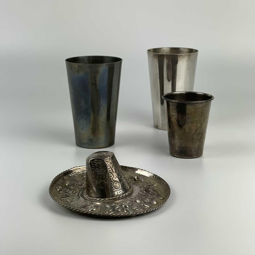 1 - A pair of Colombian 0.900 silver tumblers. A smaller tumbler, and a Mexican 925 novelty brimmed hat ... 