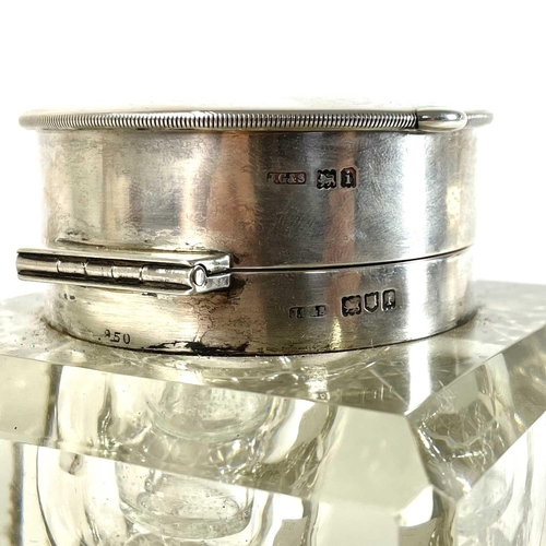 113 - An unusual silver timepiece lidded glass inkwell. By John Grinsell & Sons, the hinged lid revealing ... 