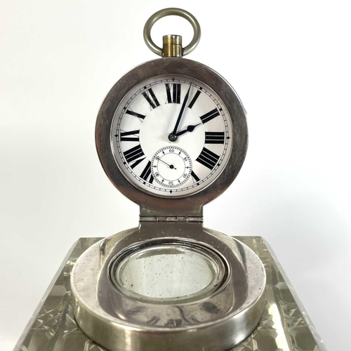 113 - An unusual silver timepiece lidded glass inkwell. By John Grinsell & Sons, the hinged lid revealing ... 