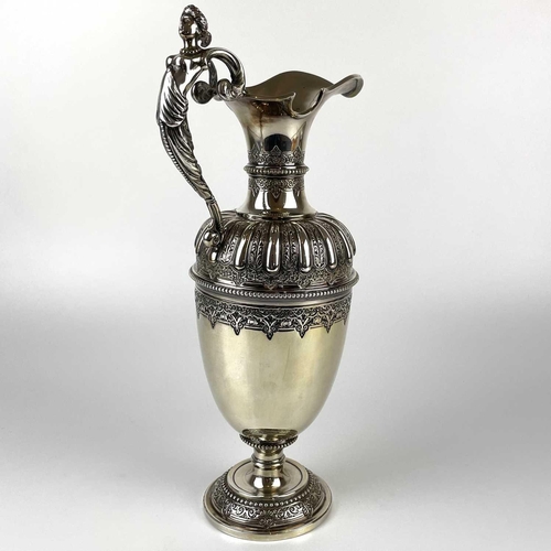 12 - An impressive Victorian silver wine ewer by Sibrey Hall & Co. The handle cast with a caryatid, the b... 