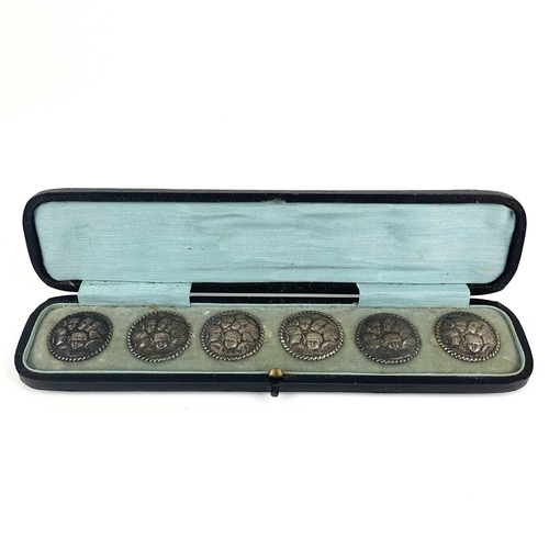 308 - A Victorian silver set of six buttons. By Levi & Salaman, embossed with angels heads after Reynolds,... 