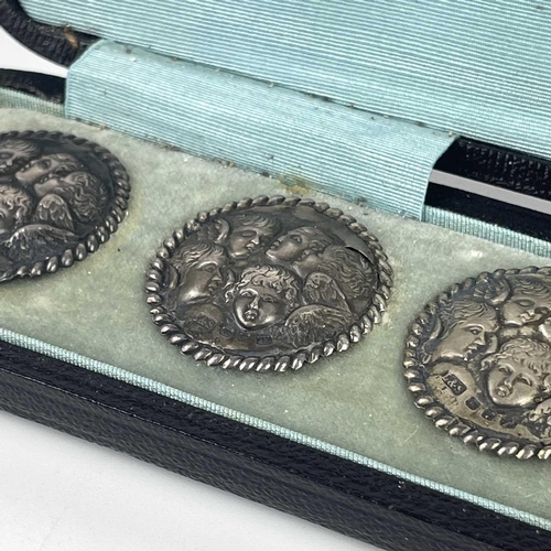 308 - A Victorian silver set of six buttons. By Levi & Salaman, embossed with angels heads after Reynolds,... 