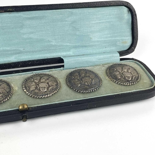 308 - A Victorian silver set of six buttons. By Levi & Salaman, embossed with angels heads after Reynolds,... 