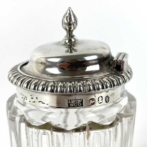 31 - A George IV silver mounted hinge lidded glass mustard pot. Maker IK.IW & Co, Sheffield 1821, height ... 