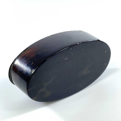 313 - A Georgian tortoiseshell silver inlaid oval snuff box. The hinged lid with silver thumbpiece and hin... 