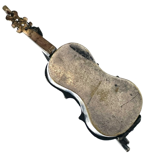 319 - A Georgian silver and gold plated patch box in the form of a violin. Hinged to reveal an inset mirro... 