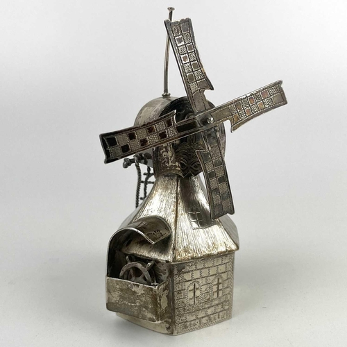 321 - A novelty white metal windmill, height 12cm, 121g. Together with a white metal circular pill box and... 