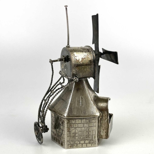 321 - A novelty white metal windmill, height 12cm, 121g. Together with a white metal circular pill box and... 