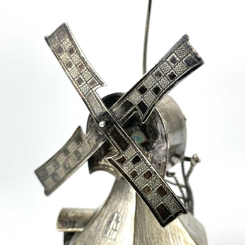 321 - A novelty white metal windmill, height 12cm, 121g. Together with a white metal circular pill box and... 