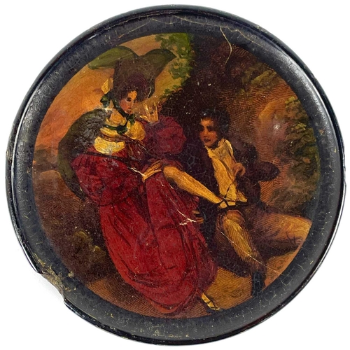 322 - An early 19th century papier mache painted snuff box. The lid painted with a courting couple, diamet... 