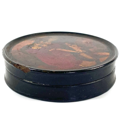 322 - An early 19th century papier mache painted snuff box. The lid painted with a courting couple, diamet... 