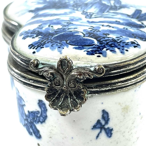 324 - A 19th century blue and white tin glazed lobed hinge lidded box The white metal rims with scallop sh... 