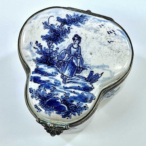 324 - A 19th century blue and white tin glazed lobed hinge lidded box The white metal rims with scallop sh... 