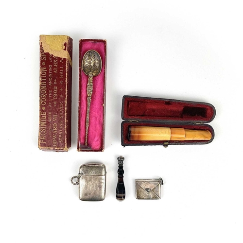 329 - A small selection of items. Including a George V silver vesta case hallmarked Birmingham 1919; An Ed... 