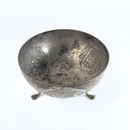 35 - A Cypriot 800 silver bowl stamped SOPHOCLIDES. The bowl embossed with three circular medallions, rai... 