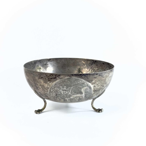 35 - A Cypriot 800 silver bowl stamped SOPHOCLIDES. The bowl embossed with three circular medallions, rai... 