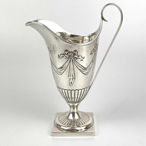 38 - A Victorian silver Adam style pedestal cream jug by George Fricker. Embossed with ribbon bow swags, ... 