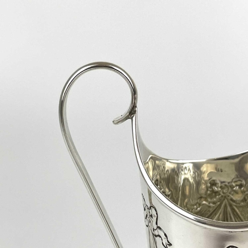 38 - A Victorian silver Adam style pedestal cream jug by George Fricker. Embossed with ribbon bow swags, ... 