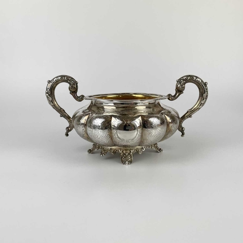 41 - An impressive William IV Irish silver three piece tea set by James Moore. Of squat lobed form with l... 