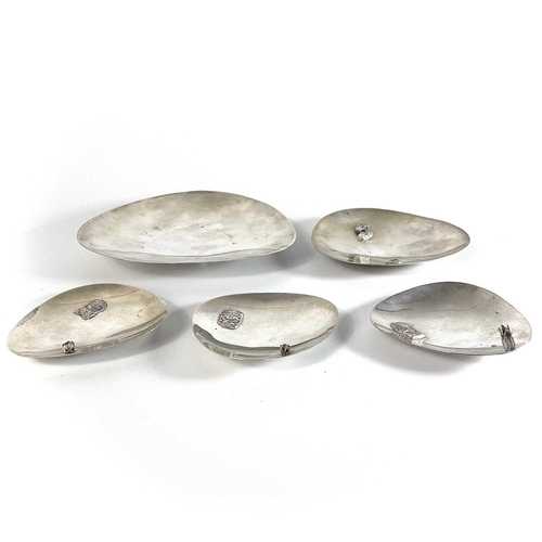 55 - Five South American .900 silver dishes. Three set with rough green stones and applied with Aztec sty... 