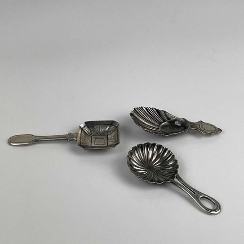 57 - A George V silver caddy spoon with shell bowl and two continental silver caddy spoons. The Georgian ... 