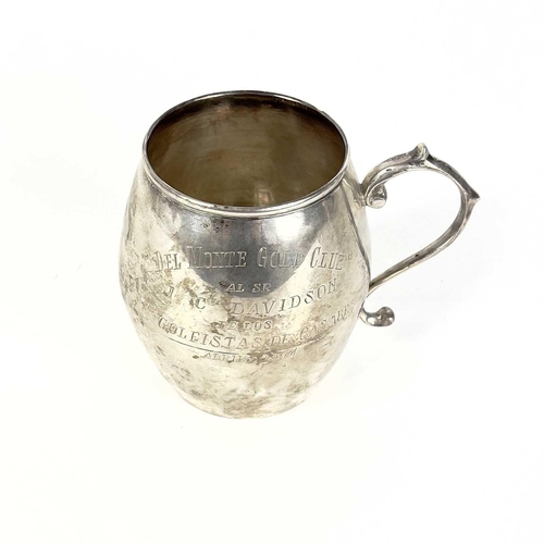 64 - A Columbian 0.900 silver trophy and a cup. The twin handled trophy with C scroll cast rim, stamped 0... 