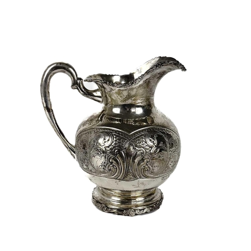 72 - A Columbian 900 silver baluster jug stamped BOGOTA. With foliate cast rims, the body with foliate sc... 