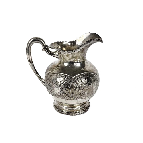 72 - A Columbian 900 silver baluster jug stamped BOGOTA. With foliate cast rims, the body with foliate sc... 