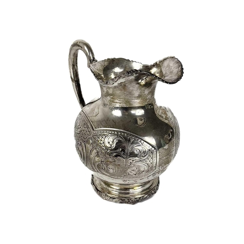 72 - A Columbian 900 silver baluster jug stamped BOGOTA. With foliate cast rims, the body with foliate sc... 