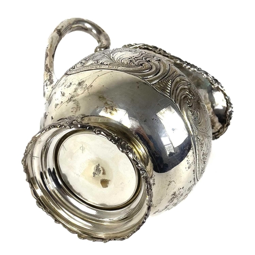 72 - A Columbian 900 silver baluster jug stamped BOGOTA. With foliate cast rims, the body with foliate sc... 