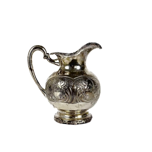 72 - A Columbian 900 silver baluster jug stamped BOGOTA. With foliate cast rims, the body with foliate sc... 