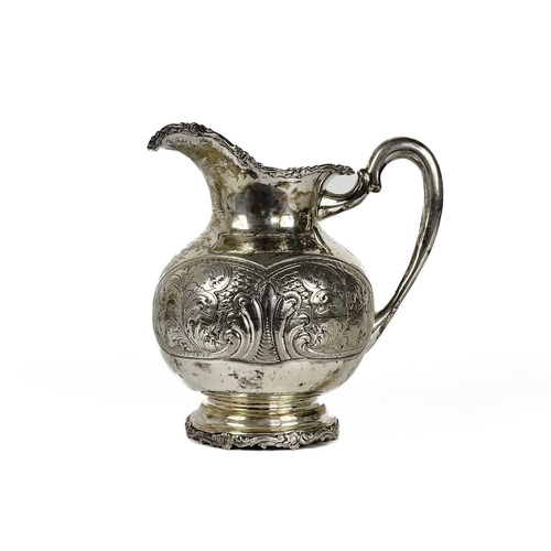 72 - A Columbian 900 silver baluster jug stamped BOGOTA. With foliate cast rims, the body with foliate sc... 