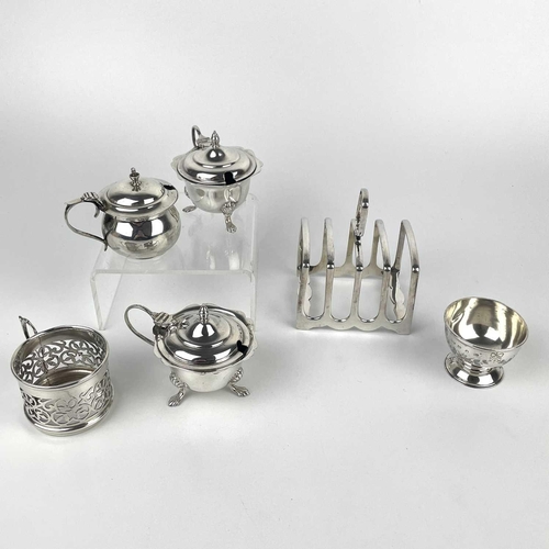 78 - A George VI silver four division toast rack, Sheffield 1949. Together with a pair of hinge lidded mu... 