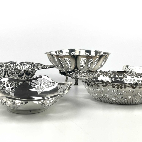 8 - A collection of nine silver hallmarked bon bon and pin dishes. Pierced and embossed decorations, 10.... 