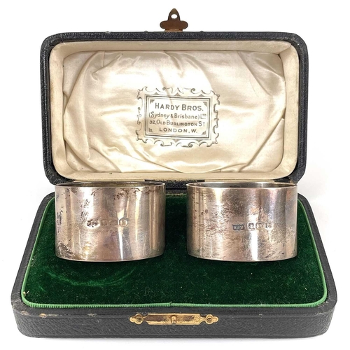 84 - A collection of silver napkin rings. To include a pair of George V heavy napkin rings by Hardy Bros ... 