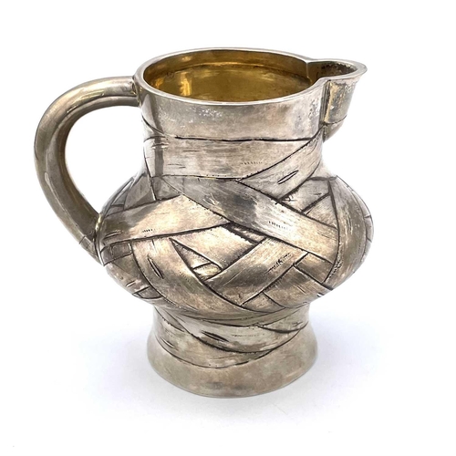 85 - A rare Imperial Russian silver and parcel gilt trompe l'oeil cream jug by Arseny Yakovlevich Sokolov... 