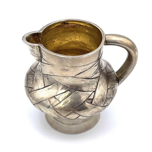 85 - A rare Imperial Russian silver and parcel gilt trompe l'oeil cream jug by Arseny Yakovlevich Sokolov... 